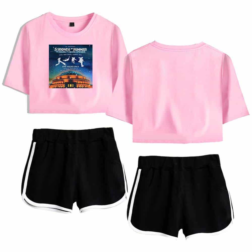 5 Seconds of Summer band merchandise, featuring a pink cropped t-shirt with album artwork and black athletic shorts with white trim. Perfect for fans and casual wear.